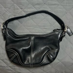 Black, leather Coach purse.
